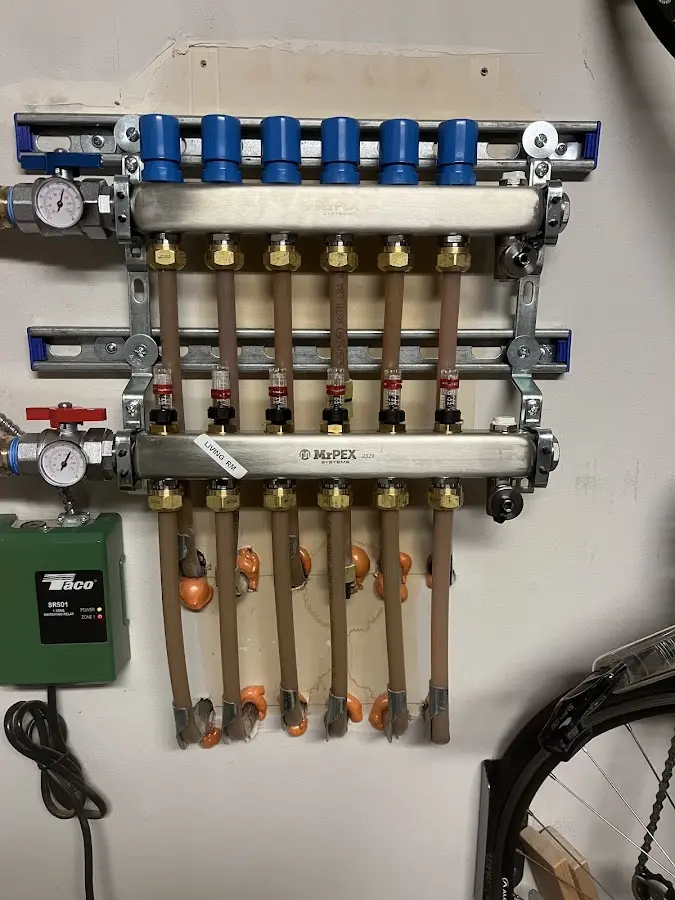 Plumber performing Water Heater Repair at a residential property in Cottage Grove